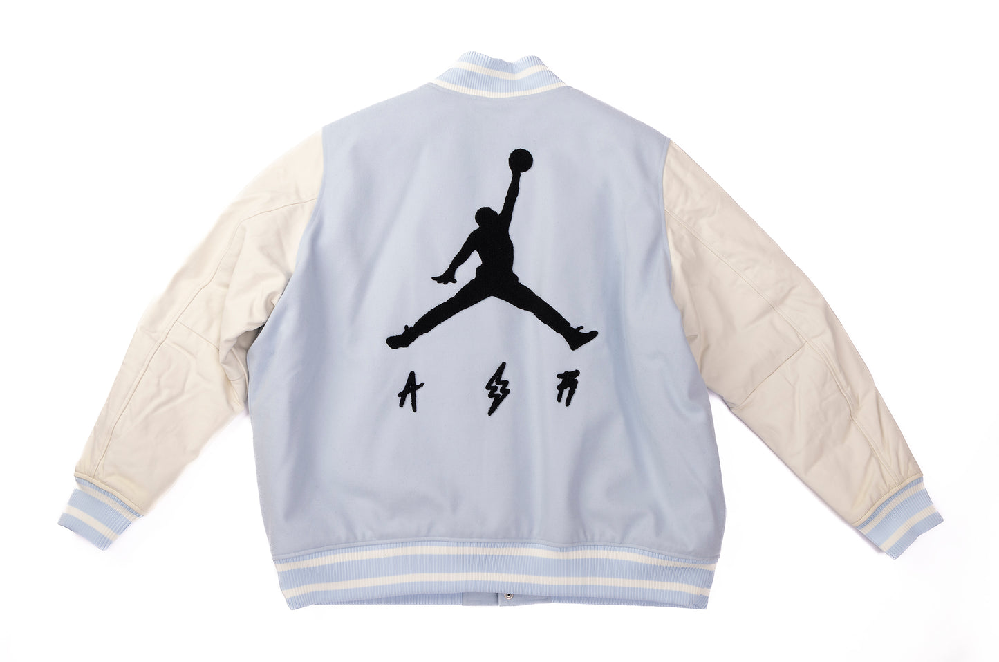 Light blue and beige jacket with a black silhouette design on the back against a white background