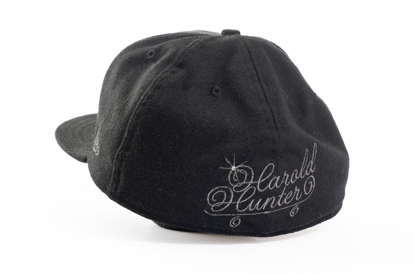 Black cap with 'Harold Hunter' embroidery on a white background