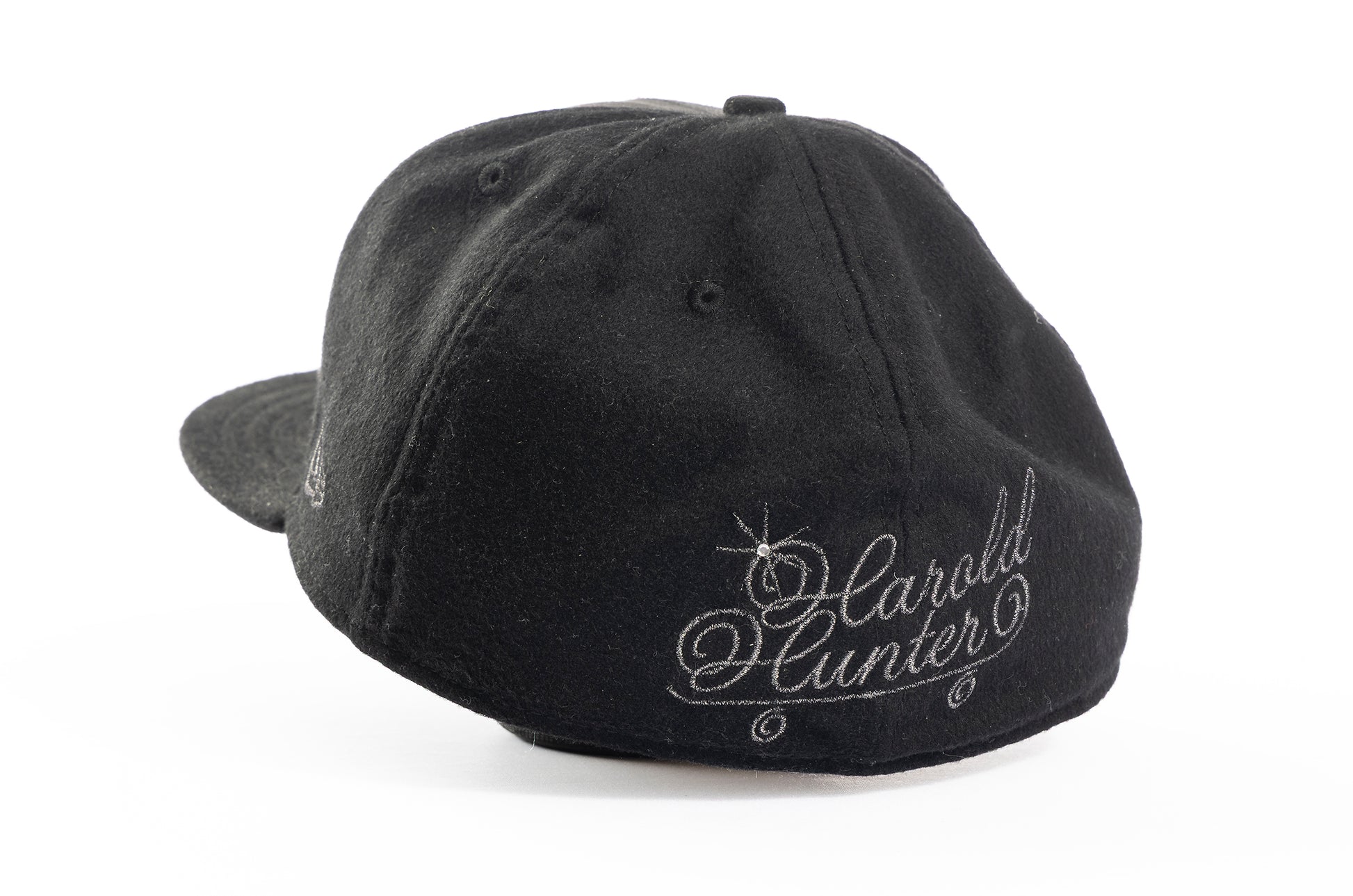 Black cap with 'Harold Hunter' embroidery on a white background